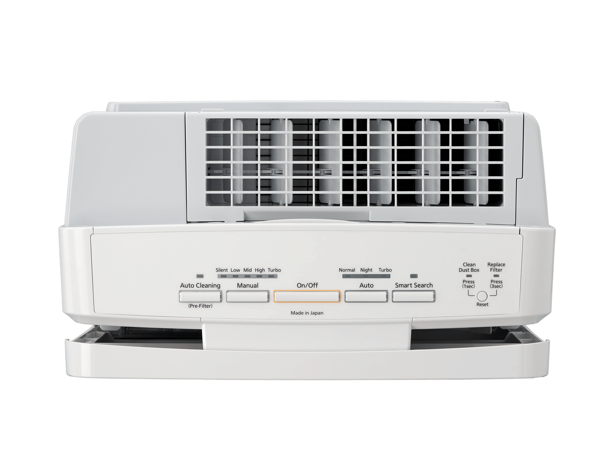 White air conditioner on a green background