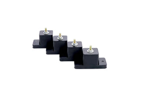 Set of black rubber blocks with metal studs on a white background